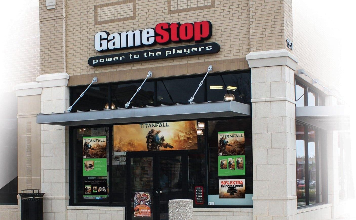 Exterior of a GameStop store with posters in the window for the original Titanfall