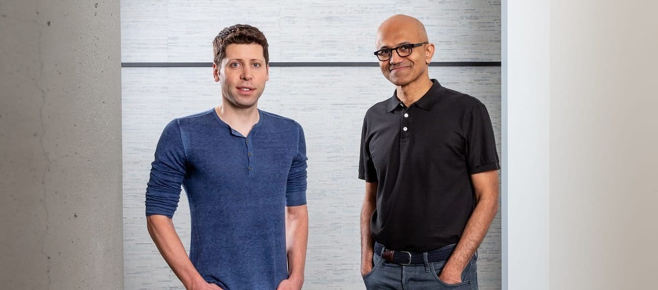 OpenAI CEO Sam Altman and Microsoft CEO Satya Nadella posing for an awkward and unnatural picture