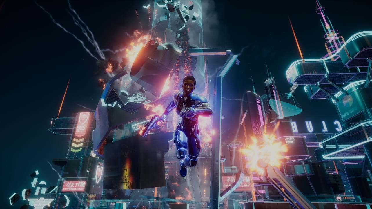 Crackdown 3: Wrecking Zone screen showing character jumping toward the screen while a building blows up behind her.