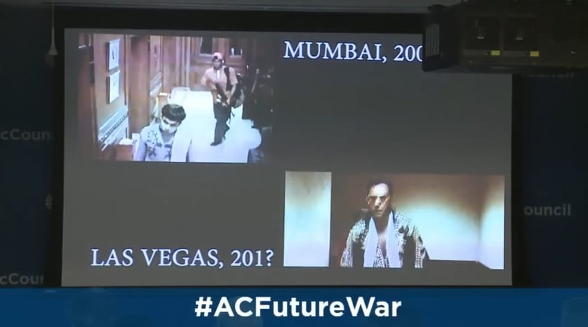 Image of a video projected onto a screen at the Atlantic Council. In the top-left is footage from the Mumbai hotel attack labelled Mumbai, 2008. In the bottom right is footage from 3000 Miles to Graceland, labelled Las Vegas, 201?