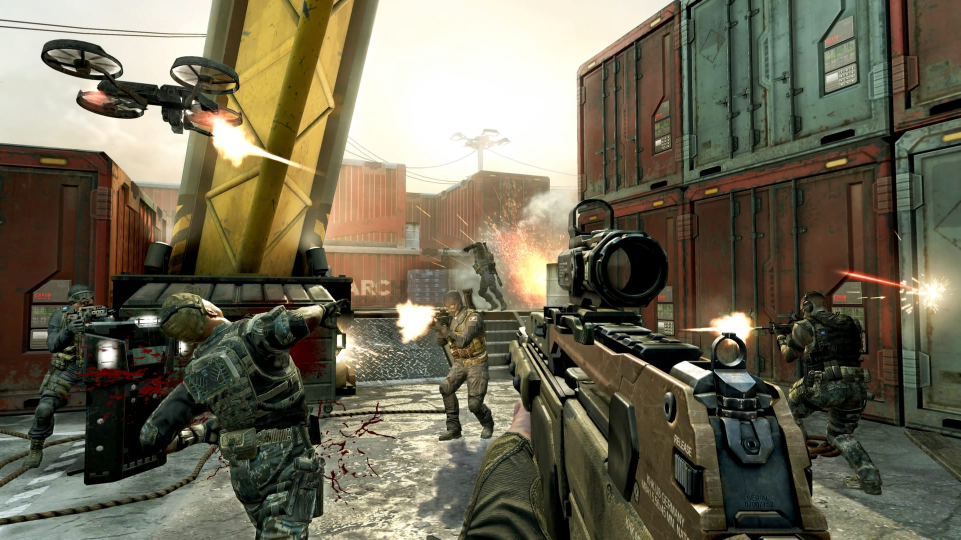 Black Ops 2 screenshot showing a firefight among shipping containers with one quad-copter drone firing as well