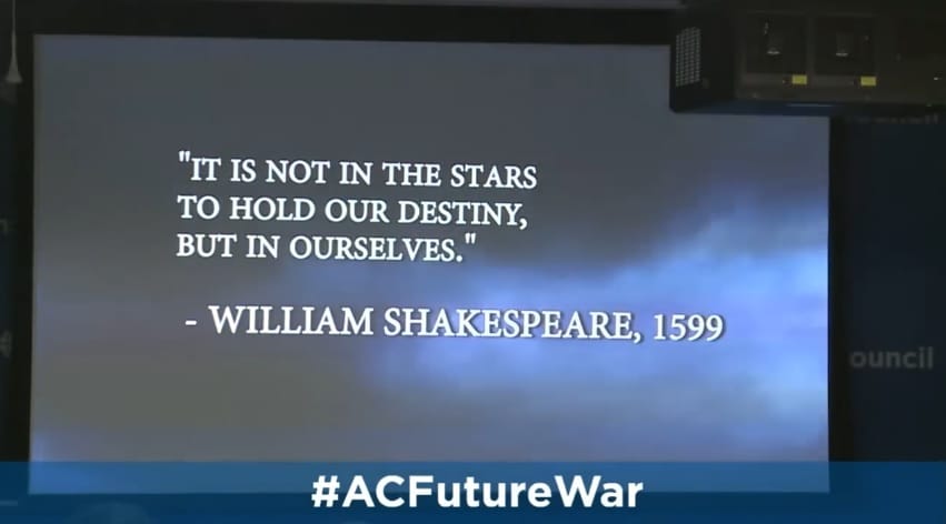 Image of a projector screen with a video clip showing dark clouds and the quote "It is not the stars to hold out destiny, but in ourselves." - William Shakespeare, 1599