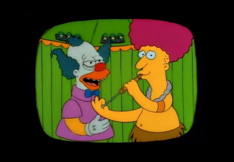 Simpsons screenshot of Krusty the Clown looking at Sideshow Bob playing a slide whistle